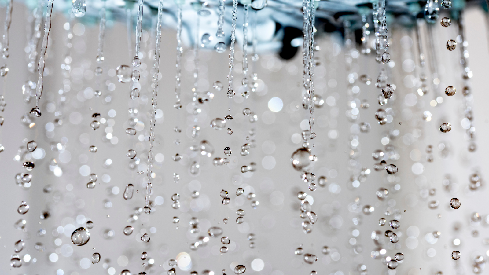 Shower water droplets slow motion close up